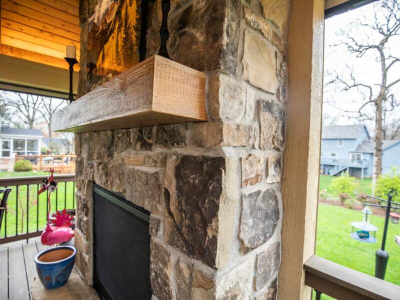 California Custom Decks retractable screen room with open deck and fireplace