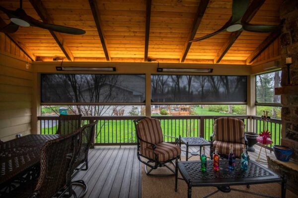 California Custom Decks retractable screen room with open deck and fireplace