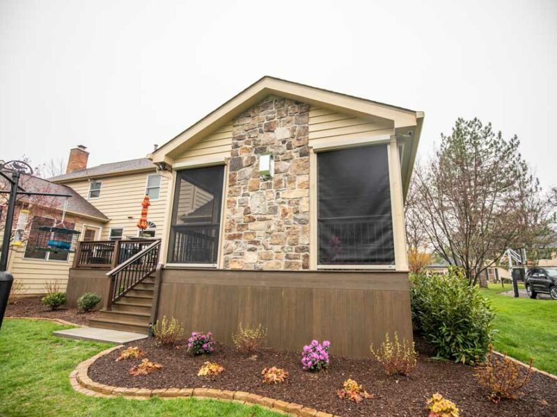 California Custom Decks retractable screen room with open deck and fireplace