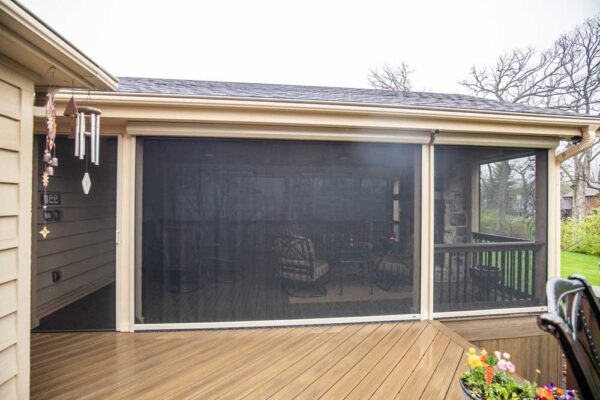 California Custom Decks retractable screen room with open deck and fireplace