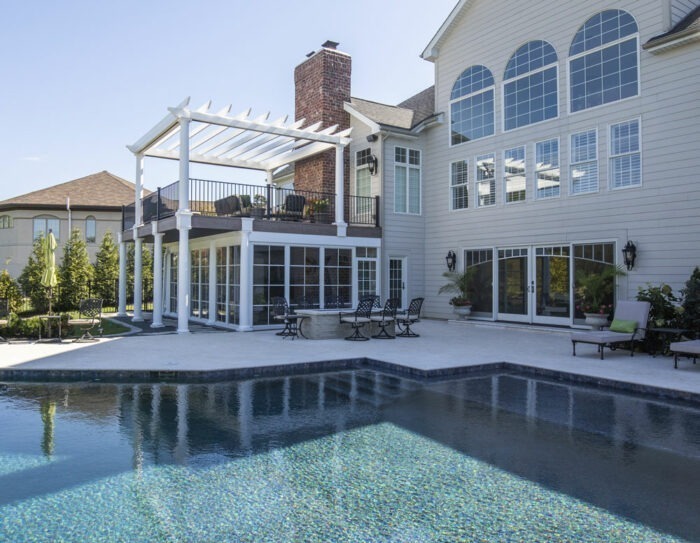 California Custom Decks white pergola and golf simulator three-season sunroom in Chesterfield Missouri