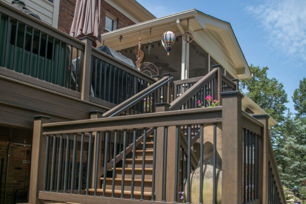 Decks stairs leading to patio and pool in Creve Coeur, MO