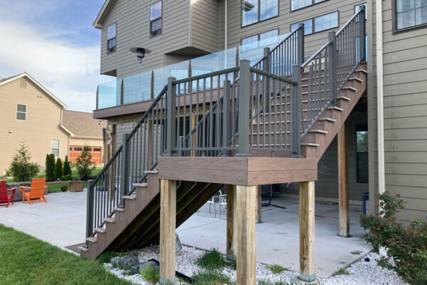 Open deck with glass railing and stairs in Creve Coeur, MO