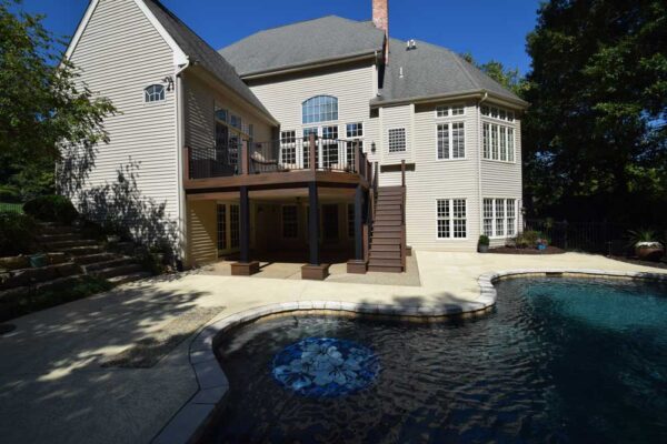 Open deck and deck stairs overlooking pool in Chesterfield, MO