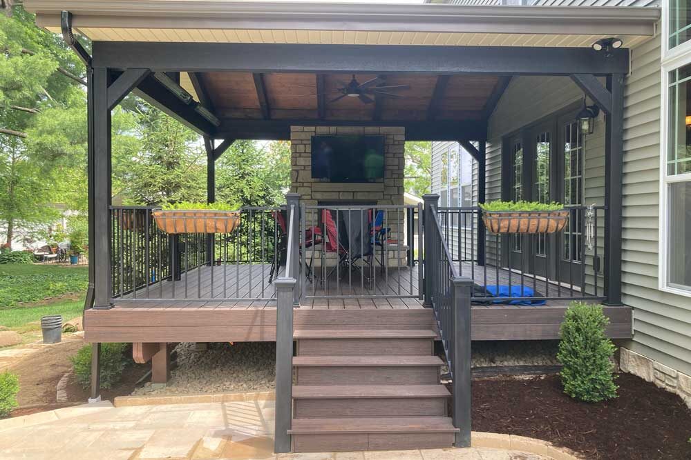 Covered deck wth fireplace in Des Peres, MO