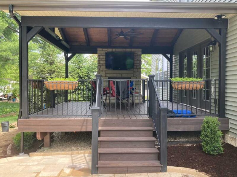 Covered deck wth fireplace in Des Peres, MO