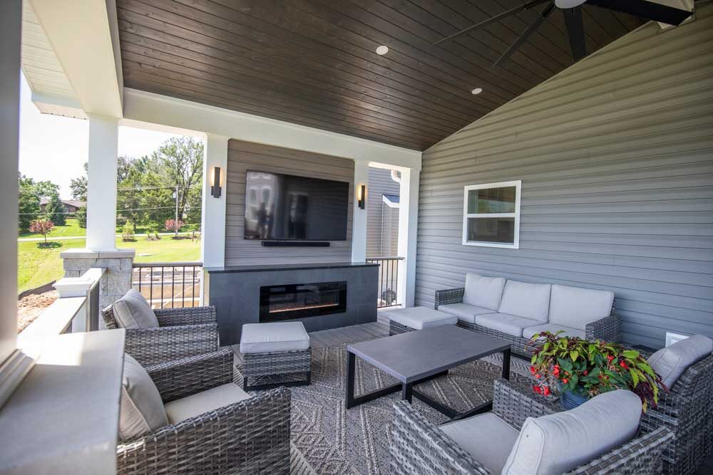 Covered deck with tv over gas fireplace in Fenton, MO