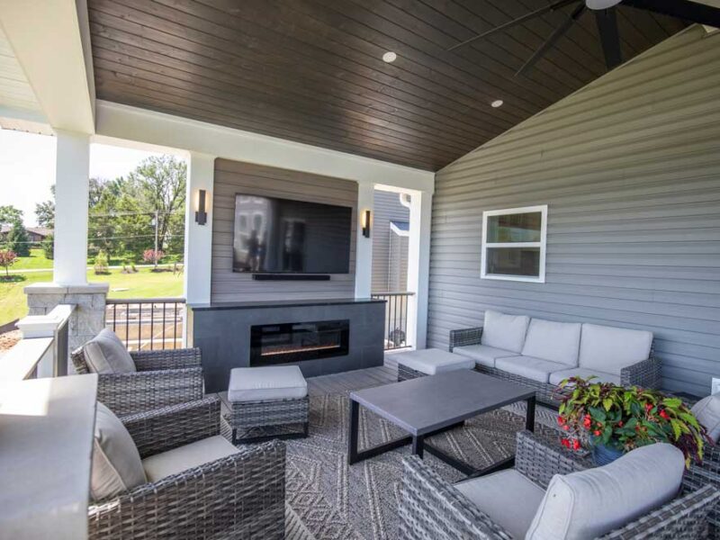 Covered deck with tv over gas fireplace in Fenton, MO