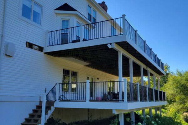 Double Decker deck with white posts and black railing in Kirkwood, MO