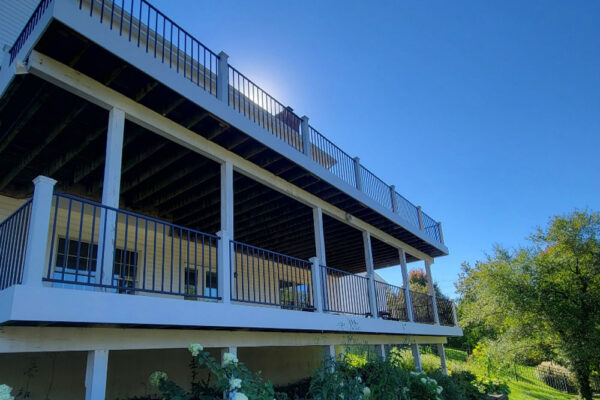 Double Decker deck with white posts and black railing in Kirkwood, MO