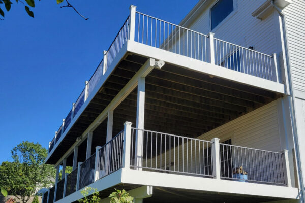 Double Decker deck with white posts and black railing in Kirkwood, MO