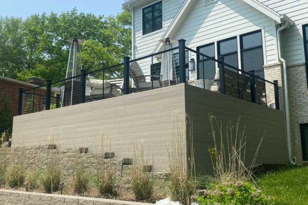 Open deck and composite wood enclosure with cable railing in Ladue MO