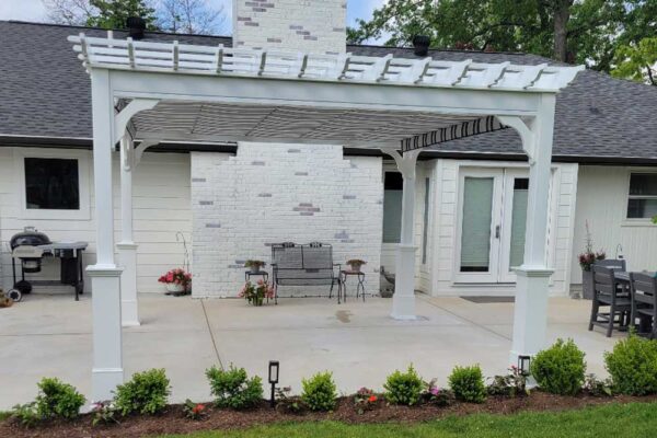 White pergola over patio in Ladue, MO