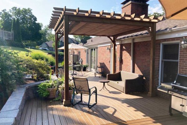 Wood pergola with shade over custom deck in Ladue, MO