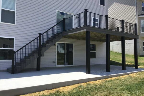 New custom composite wood deck with black railings in Manchester, MO