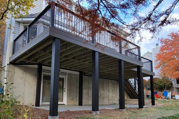 New open custom deck with black railing in Manchester MO