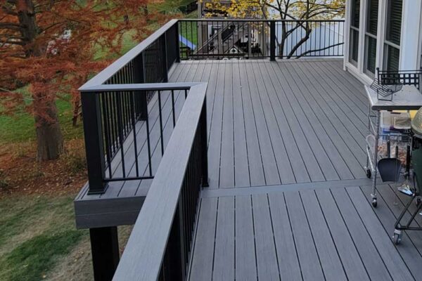 Dark composite wood deck with black railing in Manchester, MO