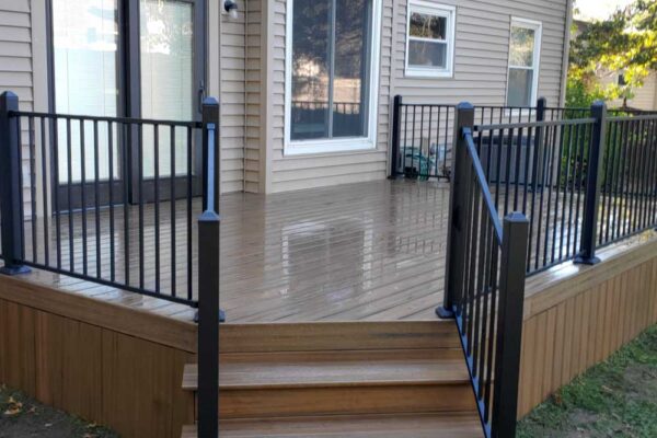 Small custom open deck with black railings in Manchester MO