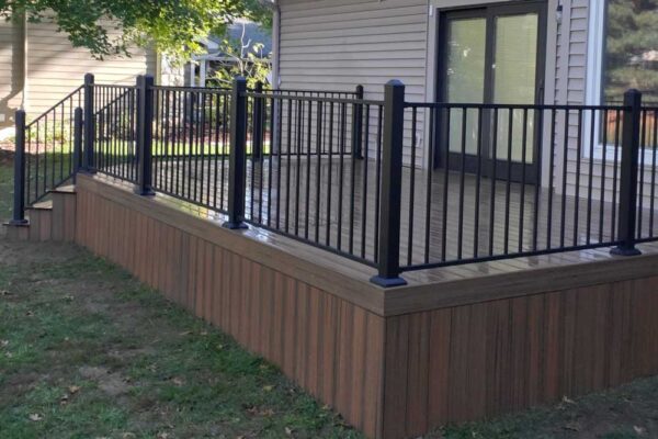 Small custom open deck with black railings in Manchester MO