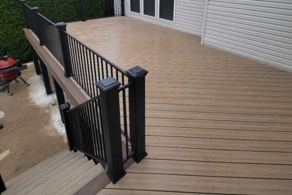 New custom composite wood deck with black railings in Manchester, MO