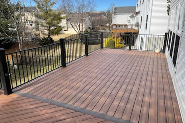 New custom composite wood deck with black railings in St. Charles County, MO