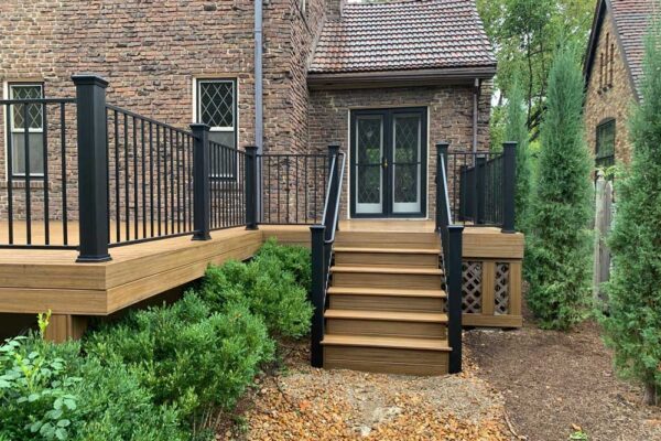 Open deck and deck stairs with black railing in St. Louis City, MO