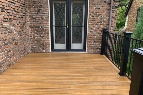 Open deck with black railing in St. Louis City, MO