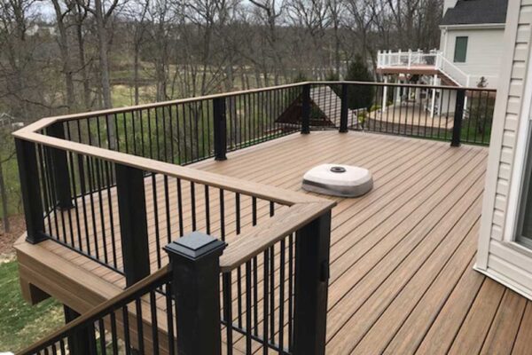 Custom composite wood deck with black railing in Sunset Hills, MO