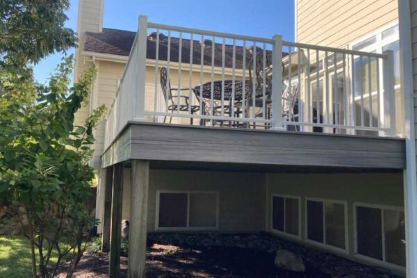 Custom composite wood grey deck with white railing in Sunset Hills, MO