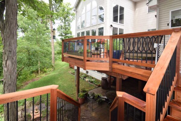 Real wood deck with black railing in Sunset Hills, MO