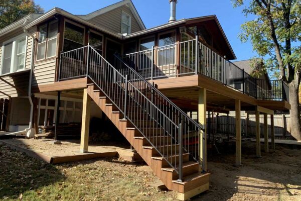 Deck stairs with black railing in Webster Groves, MO