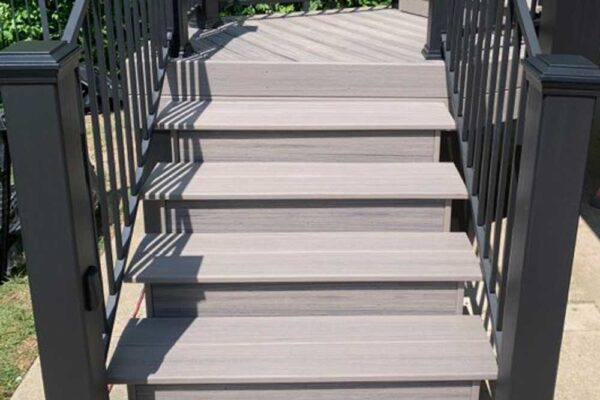 Deck stairs with black railing in Webster Groves, MO