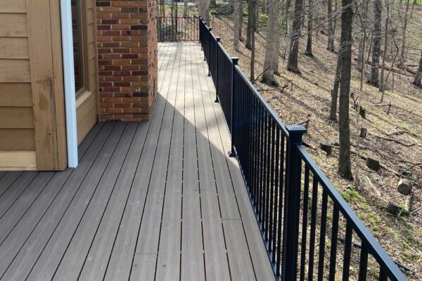 Composite wood open deck with black railing in Wildwood, MO