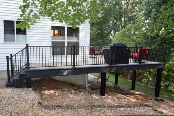 Open deck with black railing in Wildwood, MO