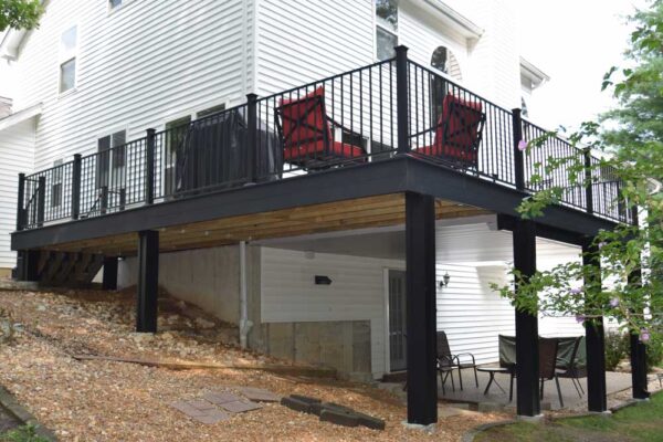 Open deck with black railing in Wildwood, MO