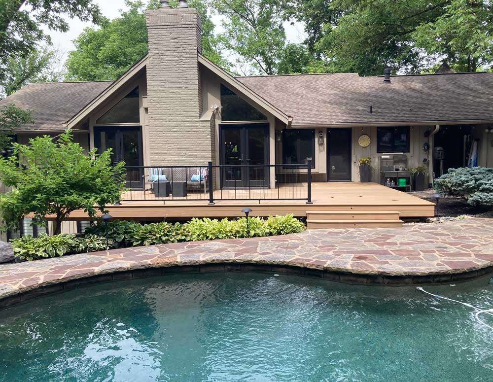 Open deck by backyard pool in Creve Coeur Missouri